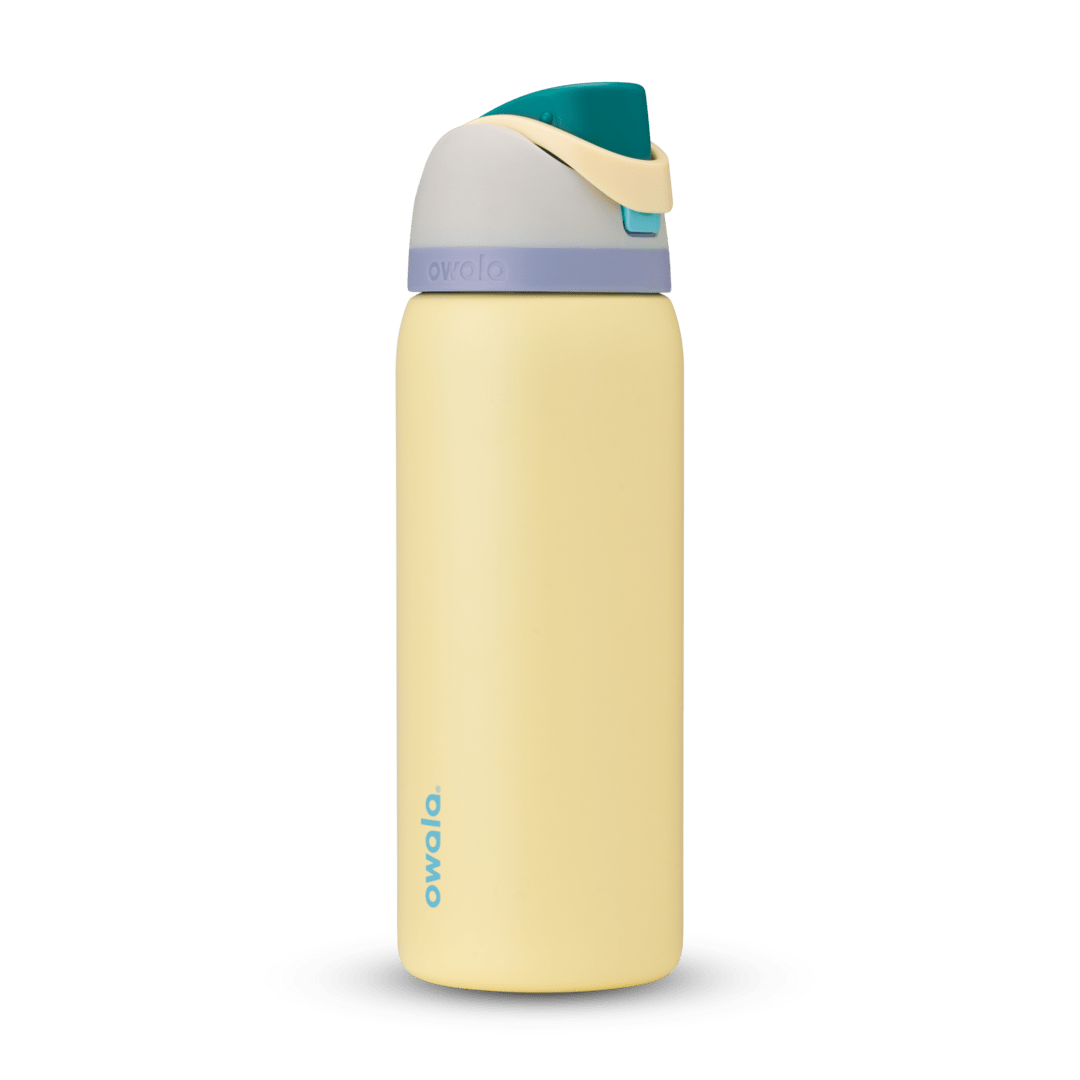 Owala FreeSip 24oz in Out of the Blue, periwinkle blue insulated bottle with matching blue-lavender flip cap and carry loop