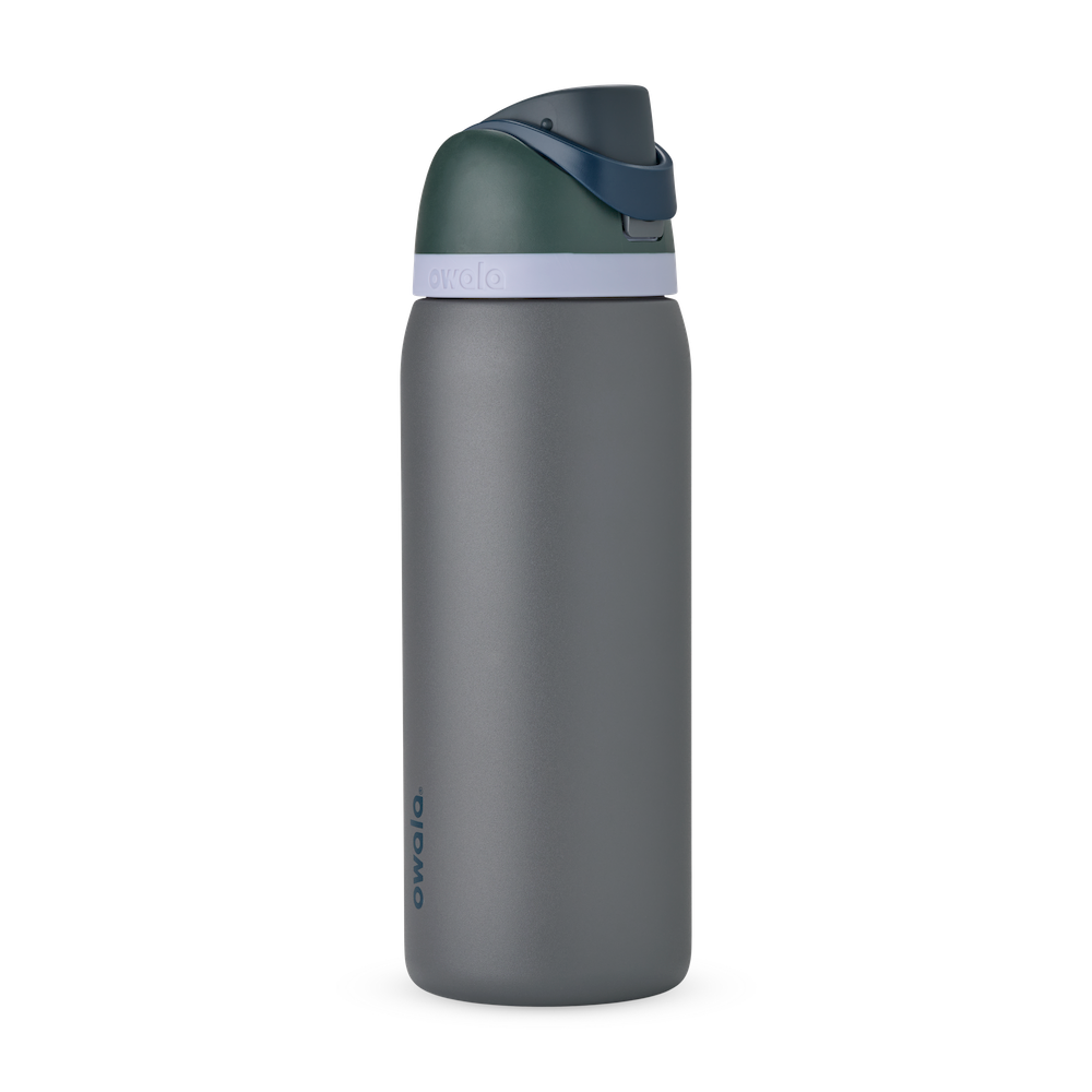 Owala FreeSip 24oz in Out of the Blue, periwinkle blue insulated bottle with matching blue-lavender flip cap and carry loop
