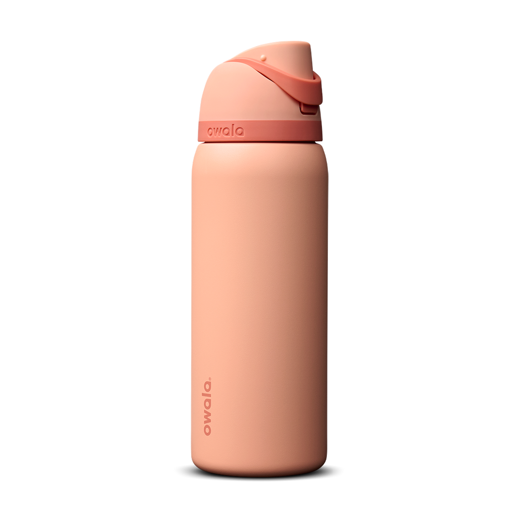 Owala FreeSip 24oz in Out of the Blue, periwinkle blue insulated bottle with matching blue-lavender flip cap and carry loop