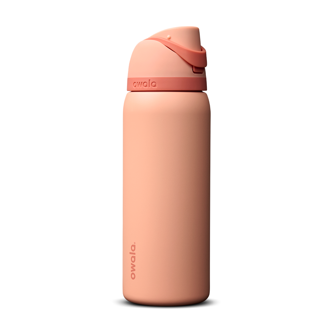 Owala FreeSip 24oz in Out of the Blue, periwinkle blue insulated bottle with matching blue-lavender flip cap and carry loop
