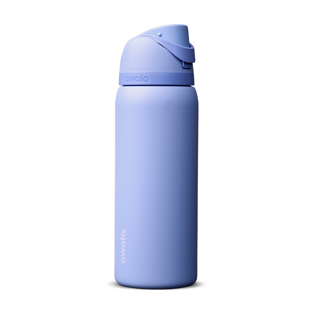 Owala FreeSip 24oz in Out of the Blue, periwinkle blue insulated bottle with matching blue-lavender flip cap and carry loop