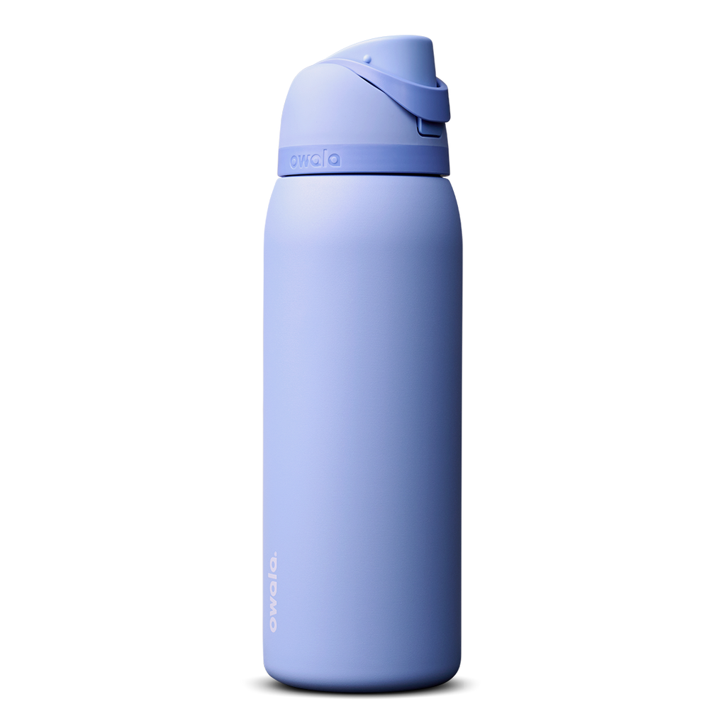 Owala FreeSip 24oz in Out of the Blue, periwinkle blue insulated bottle with matching blue-lavender flip cap and carry loop