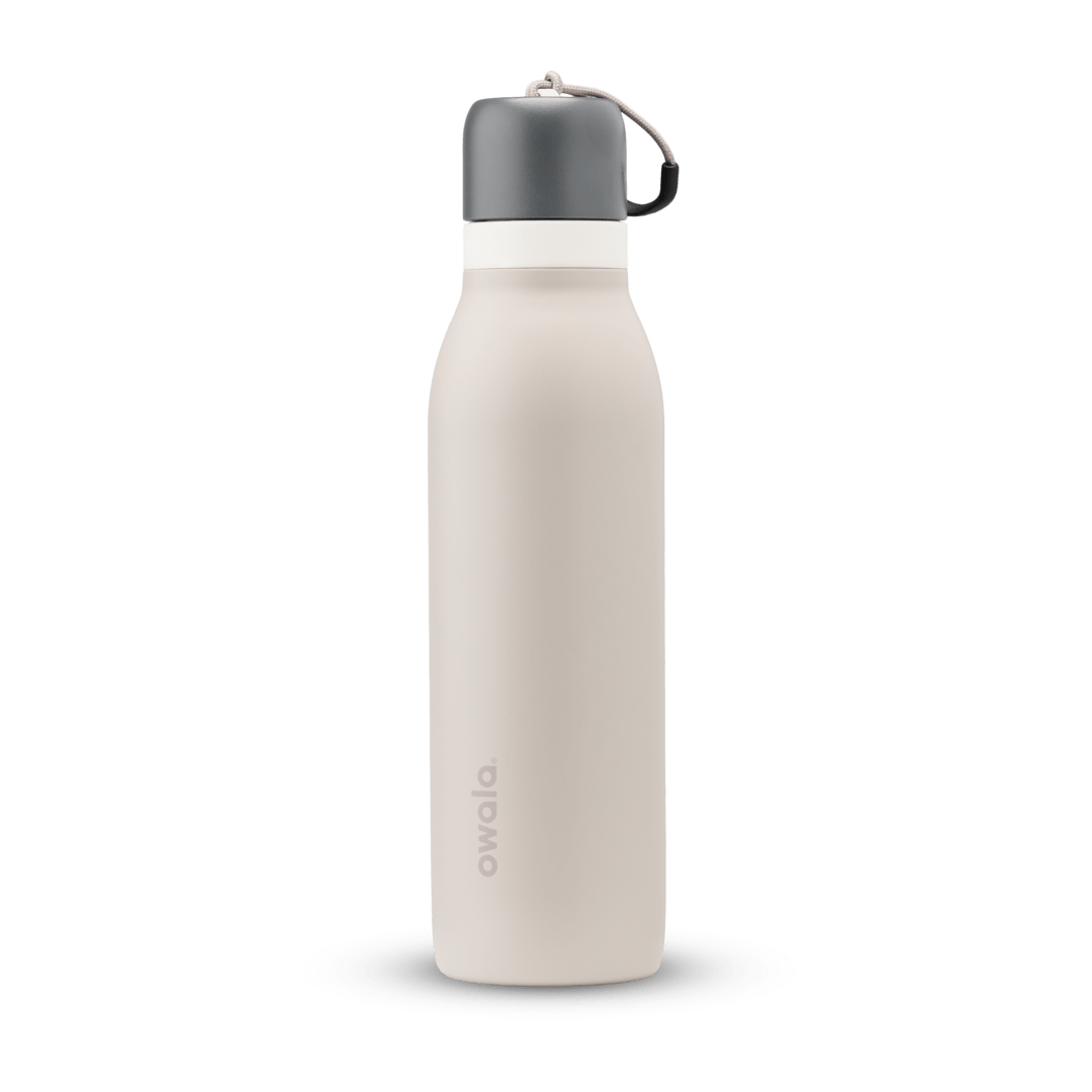 FreeSip Twist 24oz, coral pink body with orange-red lid and purple band; slim insulated bottle