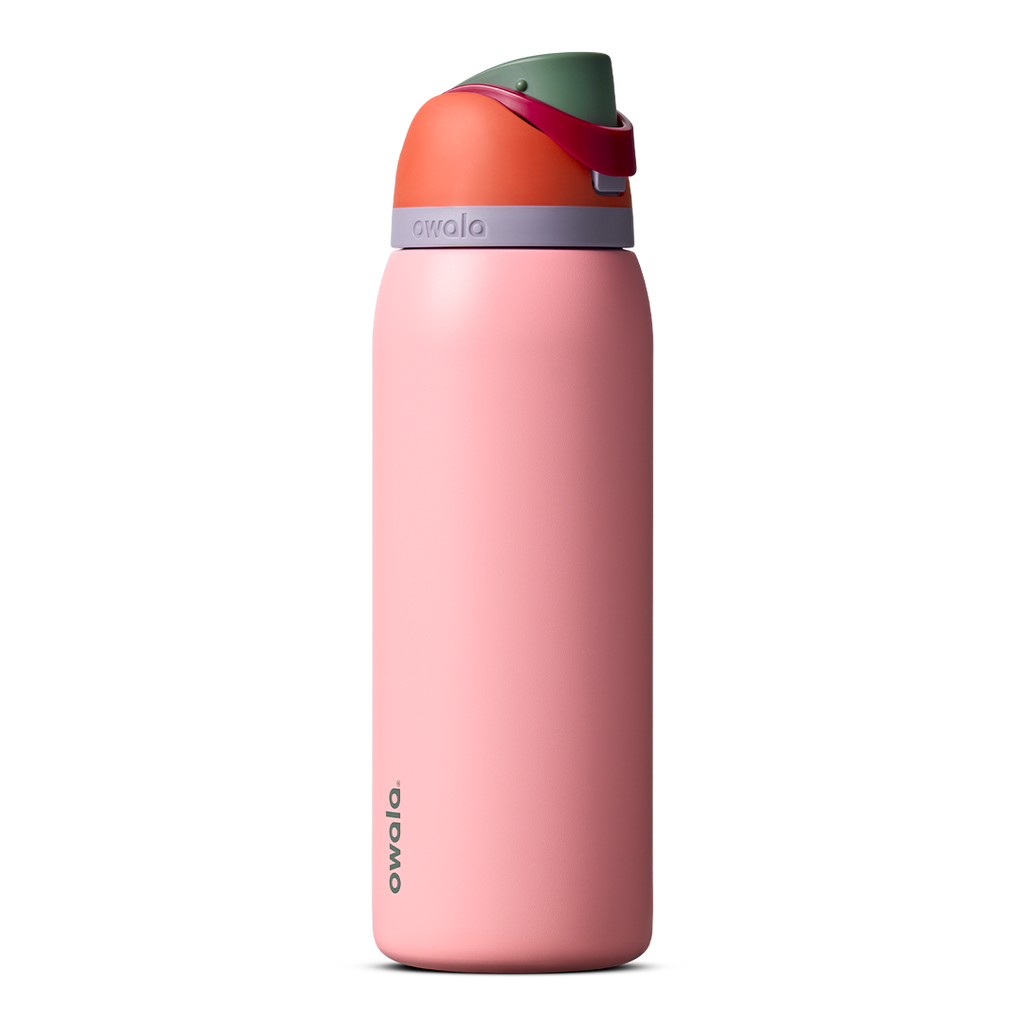 Owala FreeSip 24oz in Out of the Blue, periwinkle blue insulated bottle with matching blue-lavender flip cap and carry loop